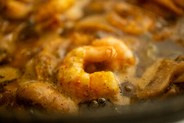 Close-up of mini shrimp cooking in a pan
