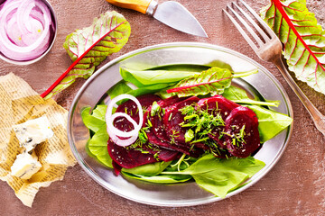 salad from boiled beet on dark background.