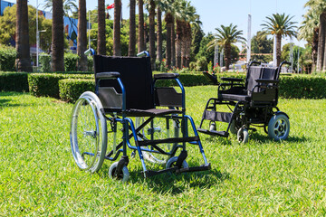 Empty wheelchair over green grass