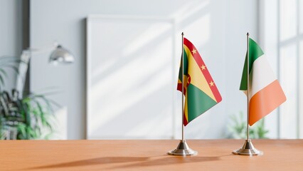 FLAGS OF GRENADA AND IRELAND ON TABLE