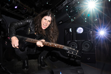 Woman playing electric guitar