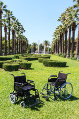 Empty wheelchair over green grass