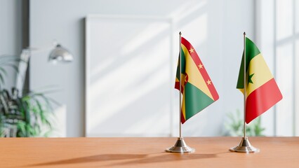 FLAGS OF GRENADA AND SENEGAL ON TABLE