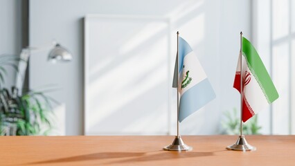 FLAGS OF GUATEMALA AND IRAN ON TABLE