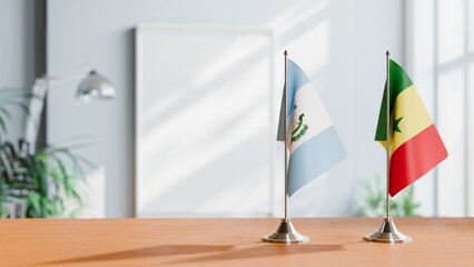 FLAGS OF GUATEMALA AND SENEGAL ON TABLE