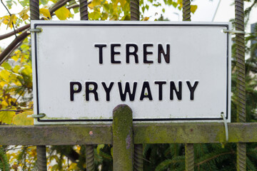 Fototapeta premium Private Property Polish Sign on Fence 