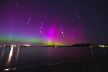 aurora with meteor shower over the lake