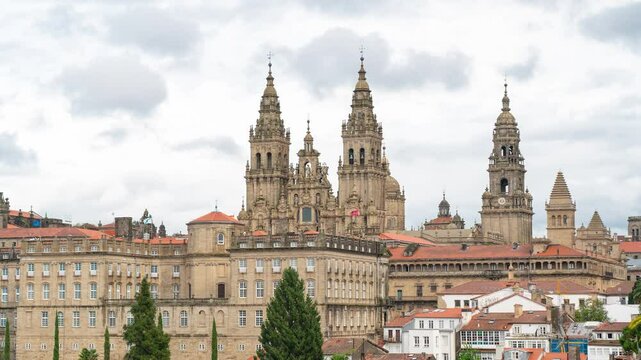 Time-Lapse, rooftops of Santiago de Compostela. View of Cathedral of Santiago. Cloudy rainy day, typically for Galicia. Famous travel destination.