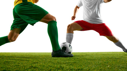 Close-up of two soccer players competing, showcasing dynamic clash of legs and intense focus on ball on green soccer stadium against white studio background. Concept of sport event, championship. Ad