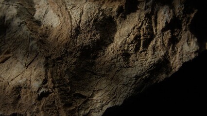 Obraz premium Weathered rock surface with light shadow play