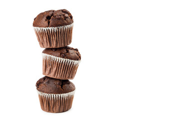 Pile of chocolate chip muffins isolated on white background.