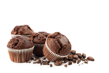 Chocolate muffins with chocolate chips and cocoa beans on white background.