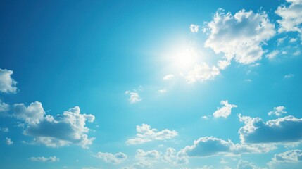 Fresh spring blue sky background with sunny glow. Bright springtime sky. Nature