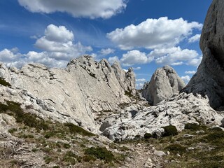 Rocky ridge of Tulove grede or karst mountain peak of Tulovice - Velebit Nature Park, Croatia (Stjenoviti greben Tulove grede ili krški planinski vrh Tulovice - Park prirode Velebit, Hrvatska)