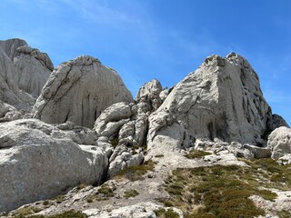 Rocky ridge of Tulove grede or karst mountain peak of Tulovice - Velebit Nature Park, Croatia (Stjenoviti greben Tulove grede ili krški planinski vrh Tulovice - Park prirode Velebit, Hrvatska)