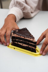 hand with cake