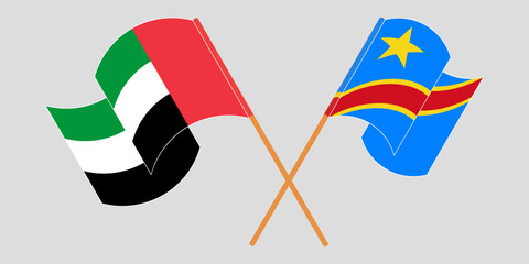 Crossed and waving flags of the United Arab Emirates and Democratic Republic of the Congo. Vector illustration