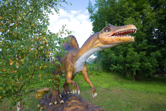 KOTELNICH, RUSSIA - AUGUST 30, 2017: A sculpture of a Spinosaurus in the paleontologic park in the sunny August afternoon