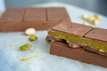 Trend Dubai chocolate with pistachio paste and kataifi dough. Confectionery handmade sweets at home...