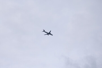 Airplane in Cloudy Sky