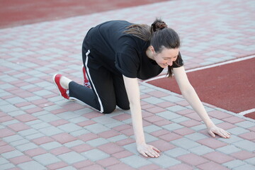 Woman doing workout exercises outside