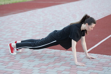 Woman doing workout exercises outside