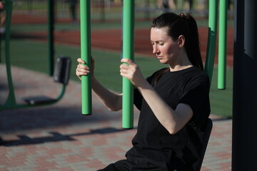 Woman doing workout exercises outside