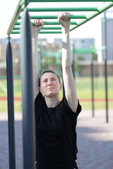 Fototapeta premium Woman doing workout exercises outside