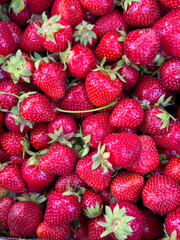 Bright and juicy fresh strawberries, a close-up of ripe berries with a rich red color.