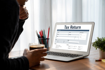 Online tax return form for submitting individual income tax return form snugly on the internet website. Government web for tax payment and return. Taxation technology concept.