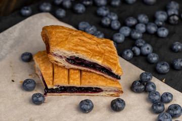 close-up of a blueberry stuffed bun with blueberries