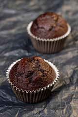 fresh and soft black chocolate cupcake on black paper