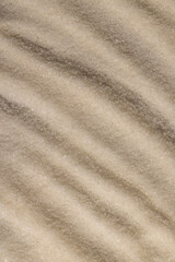 close-up of white granulated sugar on black slate