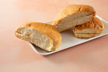 A view of some coco bread pieces on a tray.
