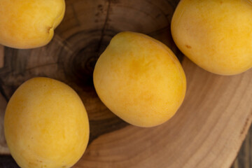 ripe soft apricot fruits on the cutting board