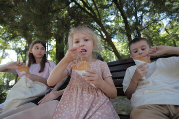 Mother and three children having fun in the park