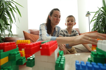 Mother and a son playing games at home
