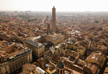 Aerial drone view of Bologna city and the two towers in the middle early in the morning, Italy. © Giannis