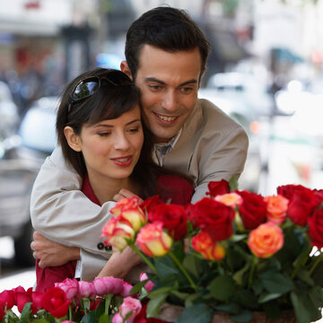 Couple Looking at Flowers in Store