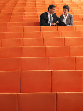 Business People  Sitting in Auditorium