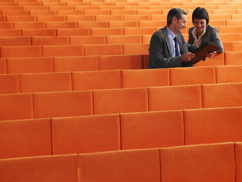 Business People  Sitting in Auditorium