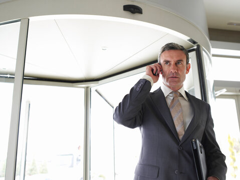 Businessman Using Cellular Telephone
