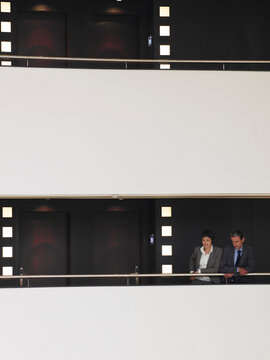 Business People on Balcony
