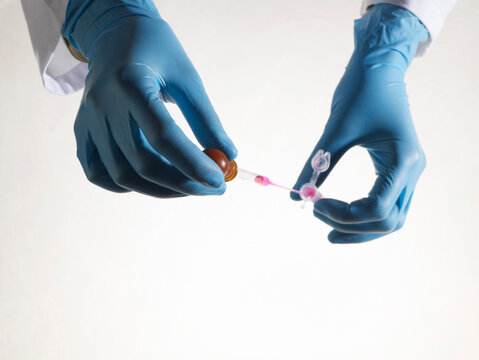 Hands Holding Test Tube