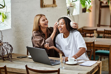 A smiling couple enjoys each other's company at a cafe, immersed in joyful conversation and playful moments.