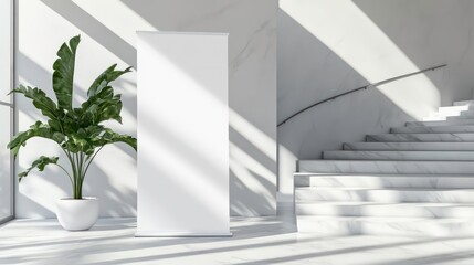 Obraz premium This white roll-up banner template stands in the lobby next to the stairs. Blank advertisement mockup in a business setting with white highlights. Commercial pull-up display isolated with white