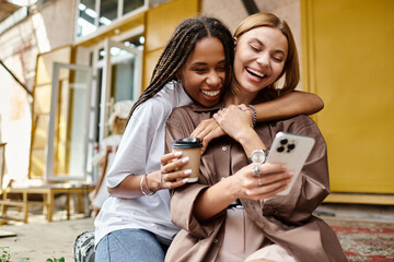 A braided-haired woman smiles warmly at her girlfriend while enjoying coffee together at a cozy...