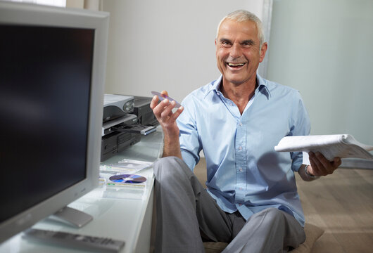 Man Looking at Instruction Manual