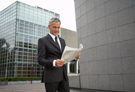 Businessman Reading Newspaper, Amsterdam, Netherlands