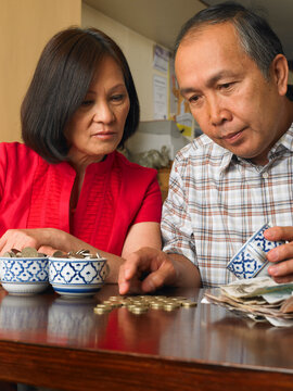 Couple Counting Coins in Restaurant